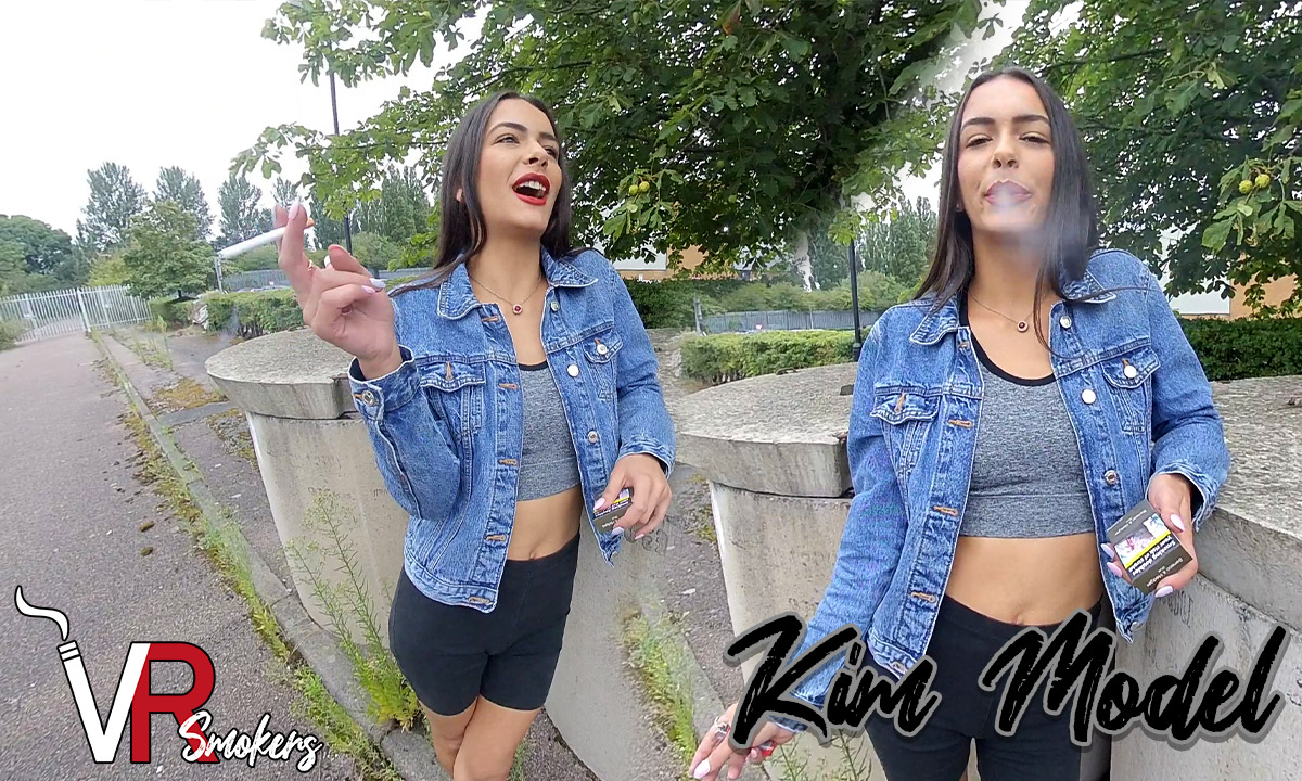 Kim Model poses outdoors during a VR Smokers interview in this non-POV 60 FPS fetish scene featuring premium video quality.