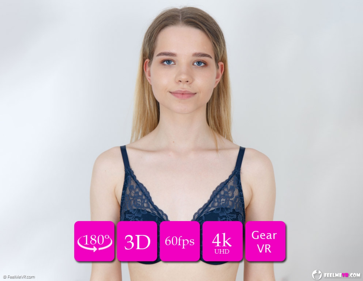 Teen model Juna poses topless during a casting session in VR180 footage with 60fps resolution and non-POV camera angles.