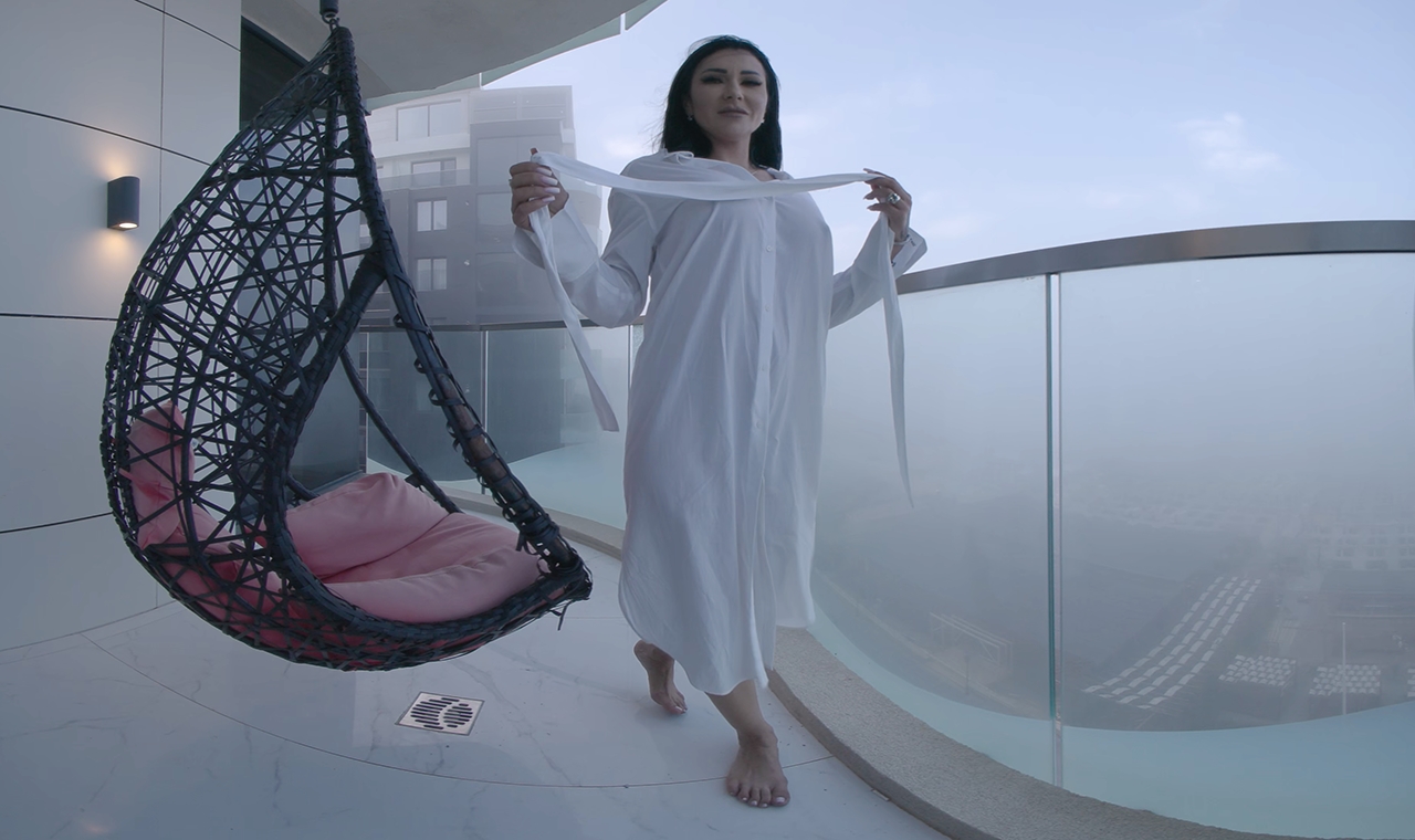Brunette Mistress Kennya teases on a balcony in this 4K BDSM VR fetish video by HouseOfLust featuring 60 FPS premium content.