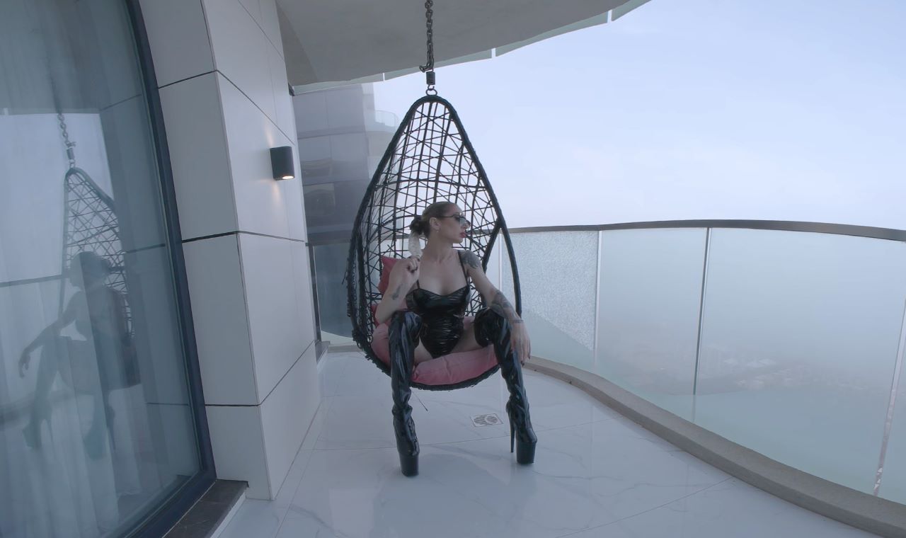 Natasha Vega performs a solo fetish scene in a POV VR video with 4K resolution and 60 frames per second.