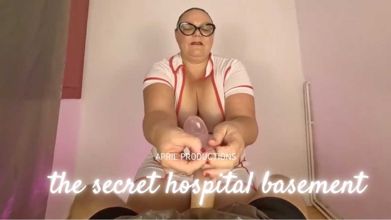 Mistress April interacts with a patient in a hospital basement setting, presented in a 4K VR POV experience by April Movie Productions.