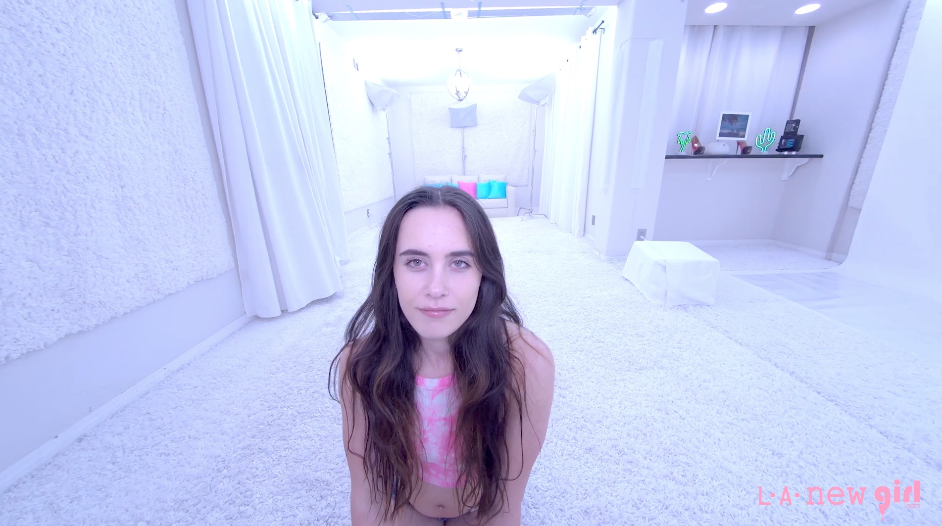 Brunette model Daisy Phoenix poses solo in a casting setup filmed in 4K VR POV for adult content.