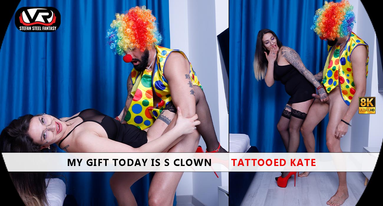 Tattooed Kate performs a non POV blowjob in 4K VR, showcasing her clown tattoo and large breasts in a studio setting.