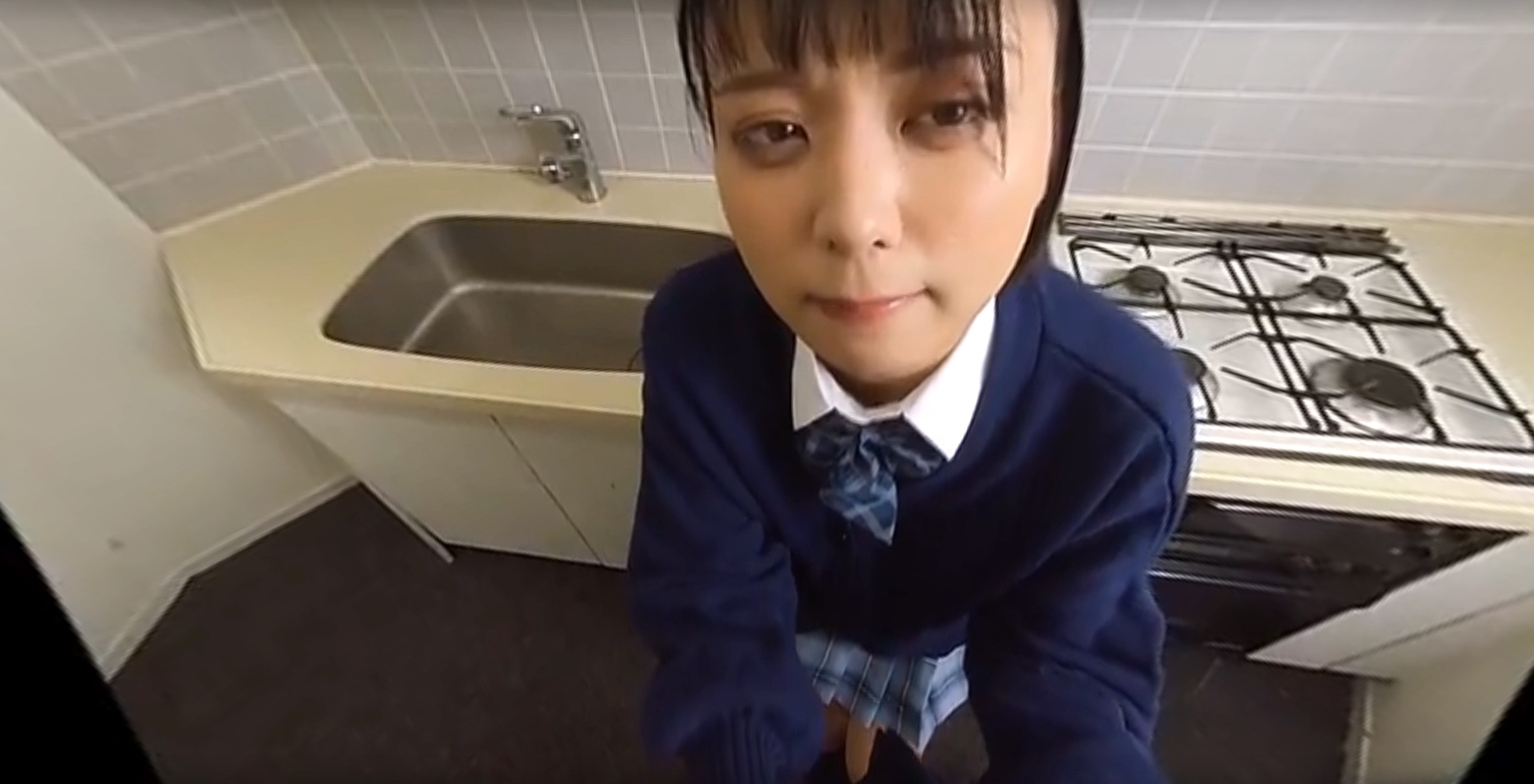 A young woman receives oral sex from a man using a remote control vibrator in a school setting during this 4K VR POV video.
