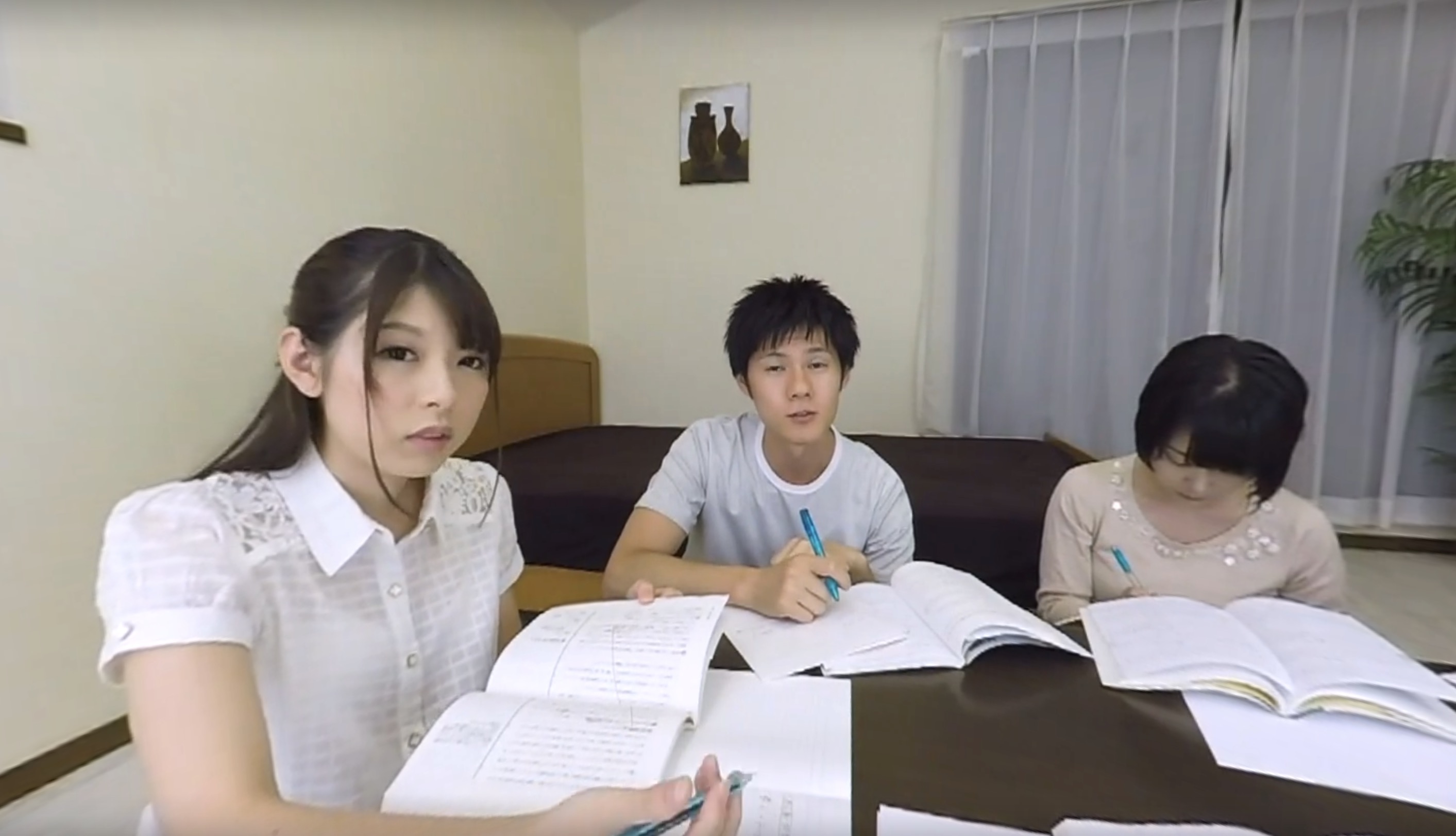 Rena Aoi in a school uniform performs oral sex in a bedroom setting for this 4K VR POV video by ETMVR.
